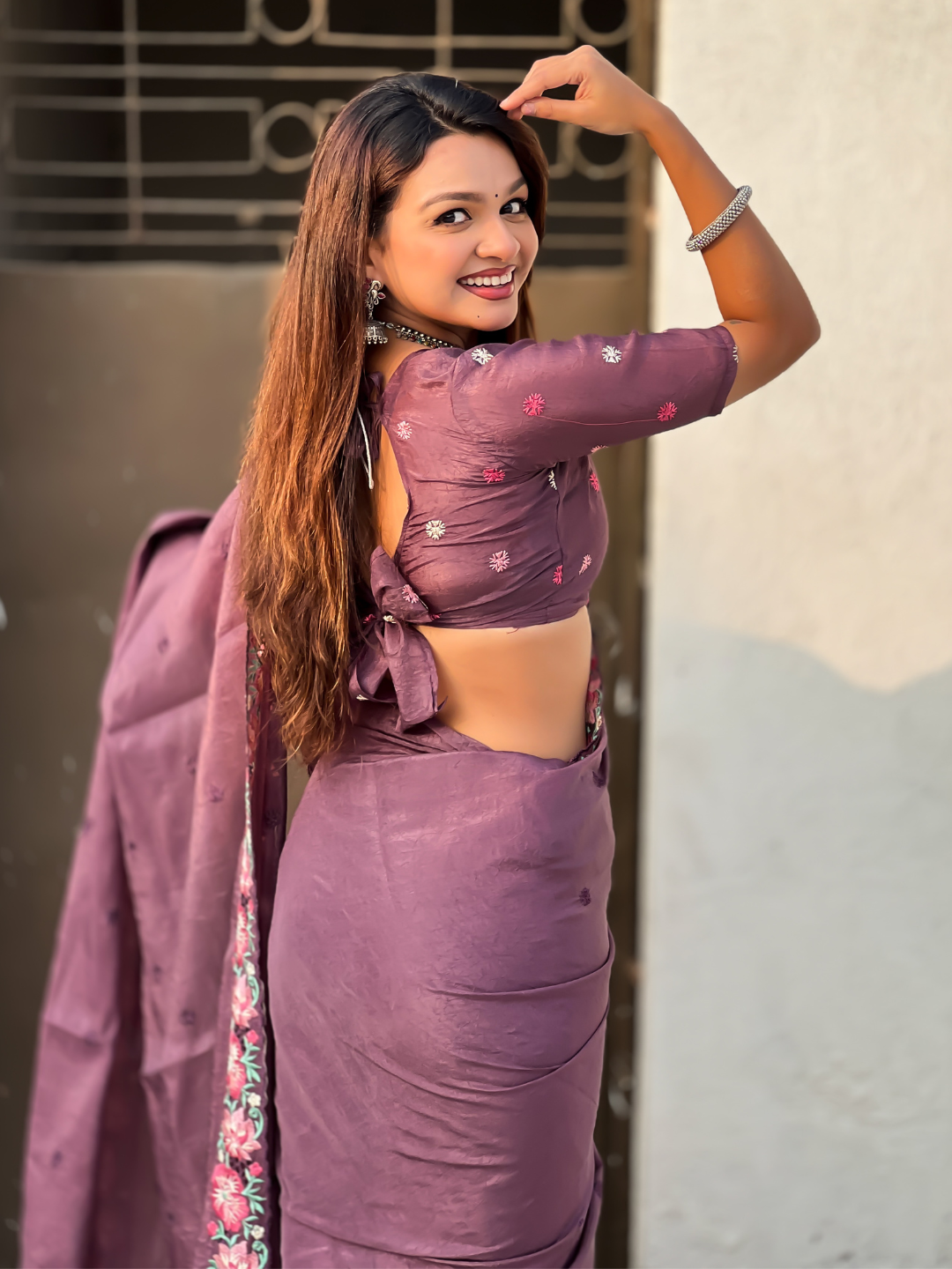 Wine pure crush embroidered saree with multicolor floral motifs and cutwork border