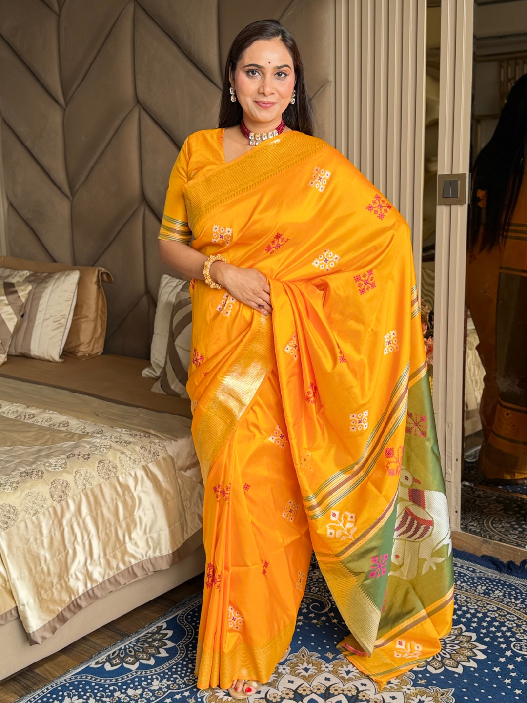 Orange Soft Silk Ikkat Patola Saree with Meenakari Motifs Peacock Pallu and Gold Zari Border