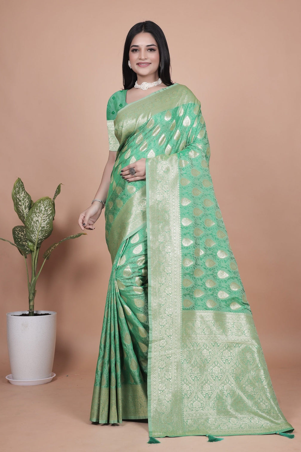 Elegant Green Banarasi Silk Saree with Golden Zari Work & Tassel Border