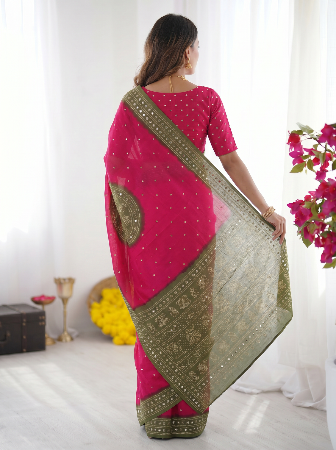 Rani pink olive green bandhani inspired modal silk saree with traditional folk print pallu stone embellishments