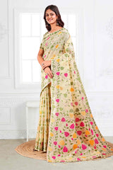 Cream Linen Cotton Silk  Saree Enhanced With Floral Zari Weaving & Tasselled Pallu Finish