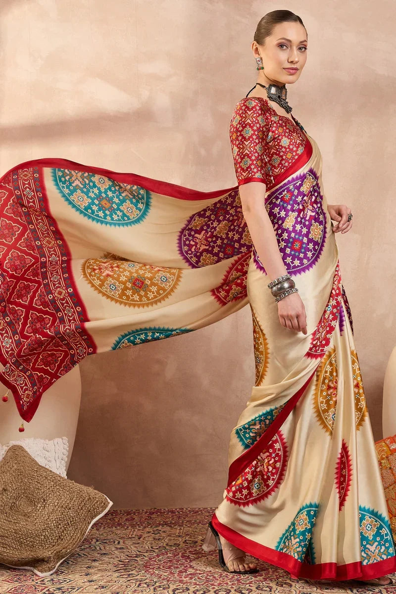 Cream modal silk saree with multicolor patola inspired print ruby red border designer festive wear saree