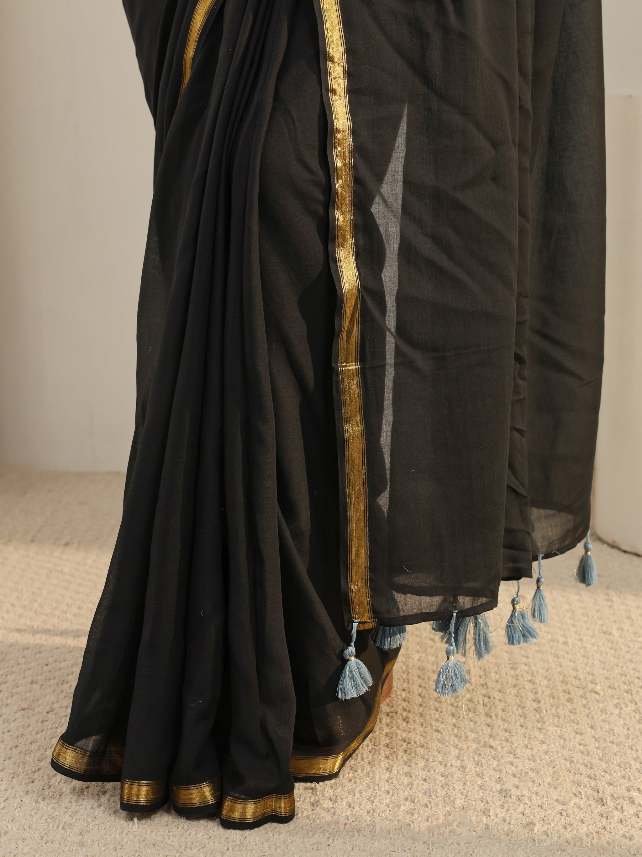 Libas Black Solid Cotton Tassel Saree
