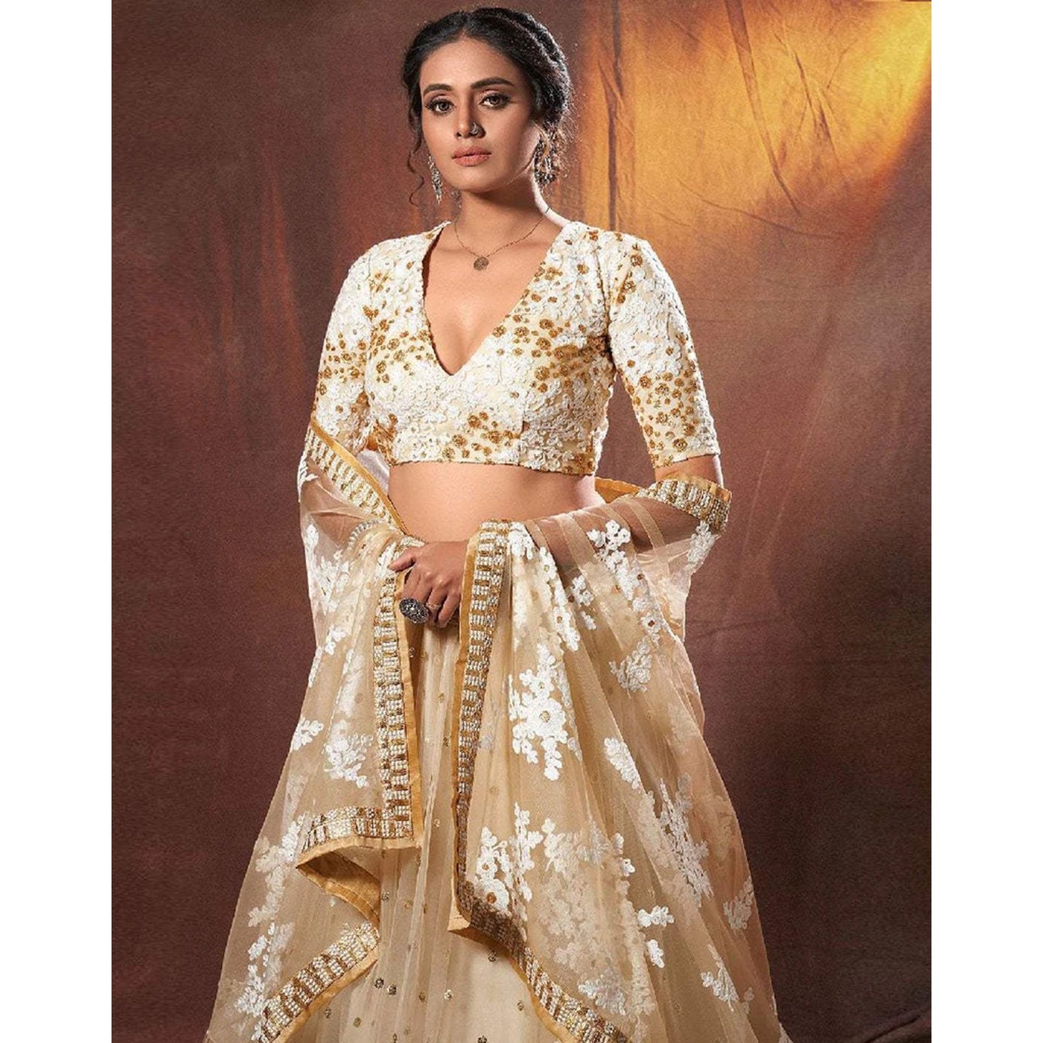 Beige Colored Lehenga Choli with Resham, Zari, and Sequence Work