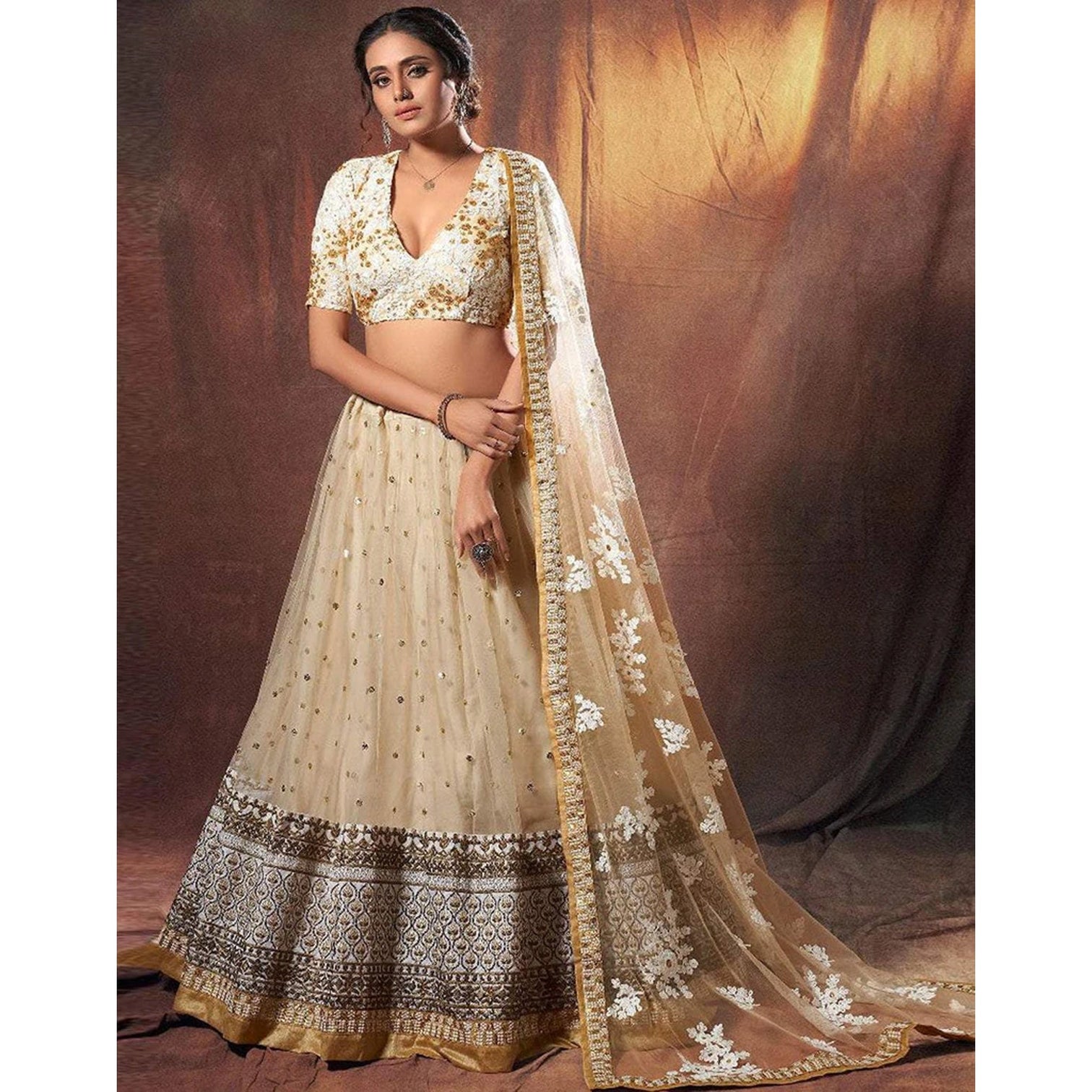 Beige Colored Lehenga Choli with Resham, Zari, and Sequence Work