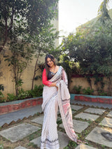 Elegant White Pure Linen Digital Printed Saree with Chevron Design and Intricate Red-Black Geometric Pallu – Tassel Details and Matching Blouse Piece