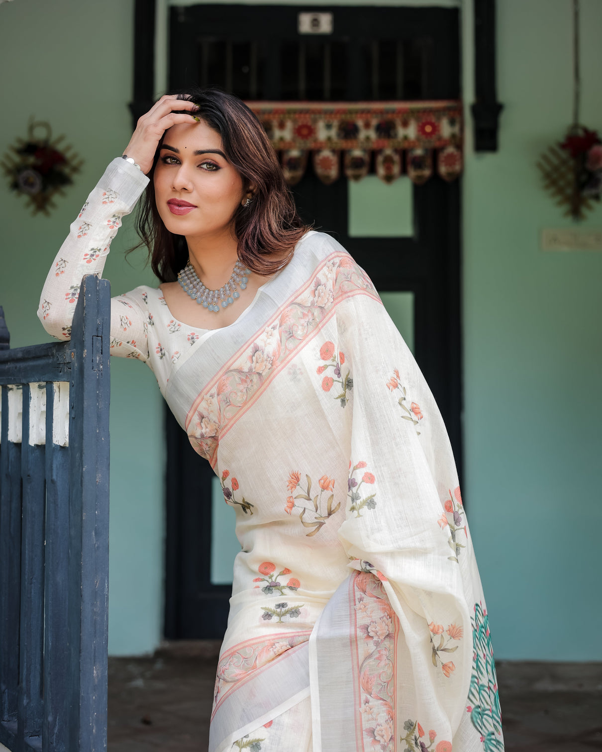 Ivory pure cotton linen saree with pastel floral design blouse and tassel detailing