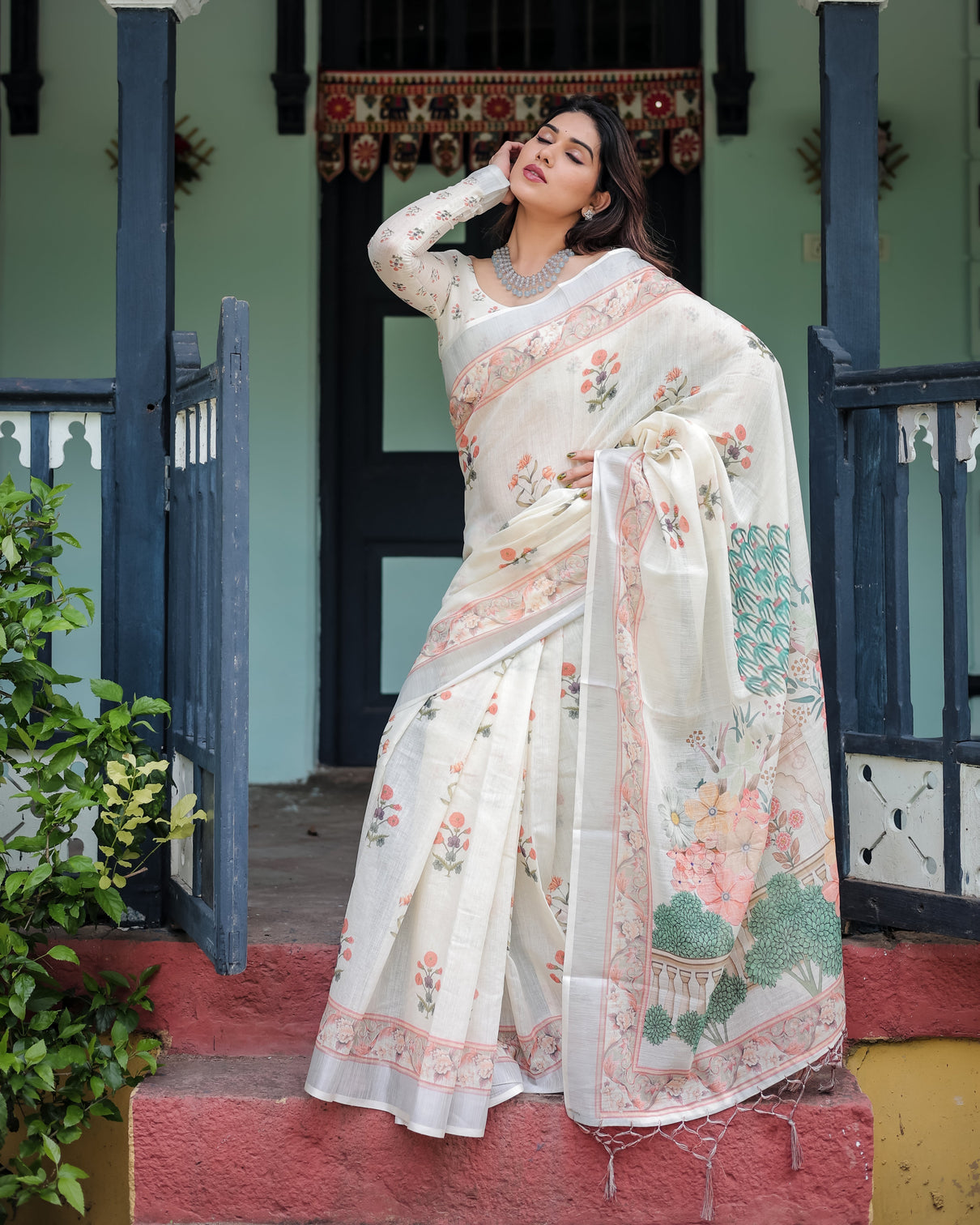 Ivory pure cotton linen saree with pastel floral design blouse and tassel detailing