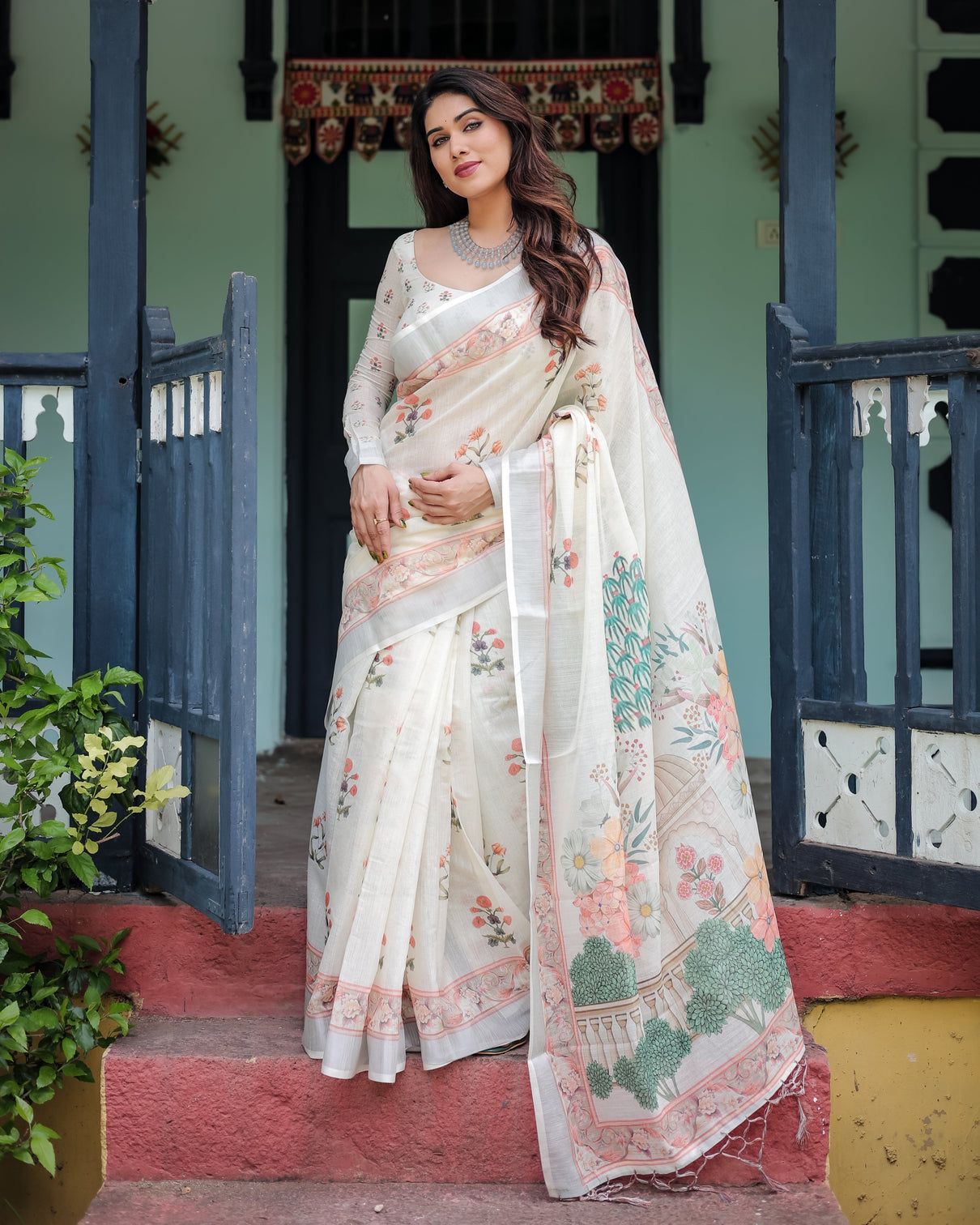 Ivory pure cotton linen saree with pastel floral design blouse and tassel detailing mameraa
