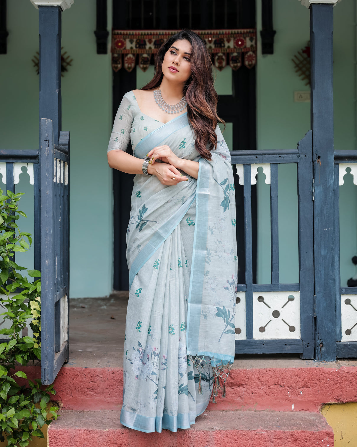 Pastel grey pure cotton linen saree with floral print blouse and tassel detailing mameraa