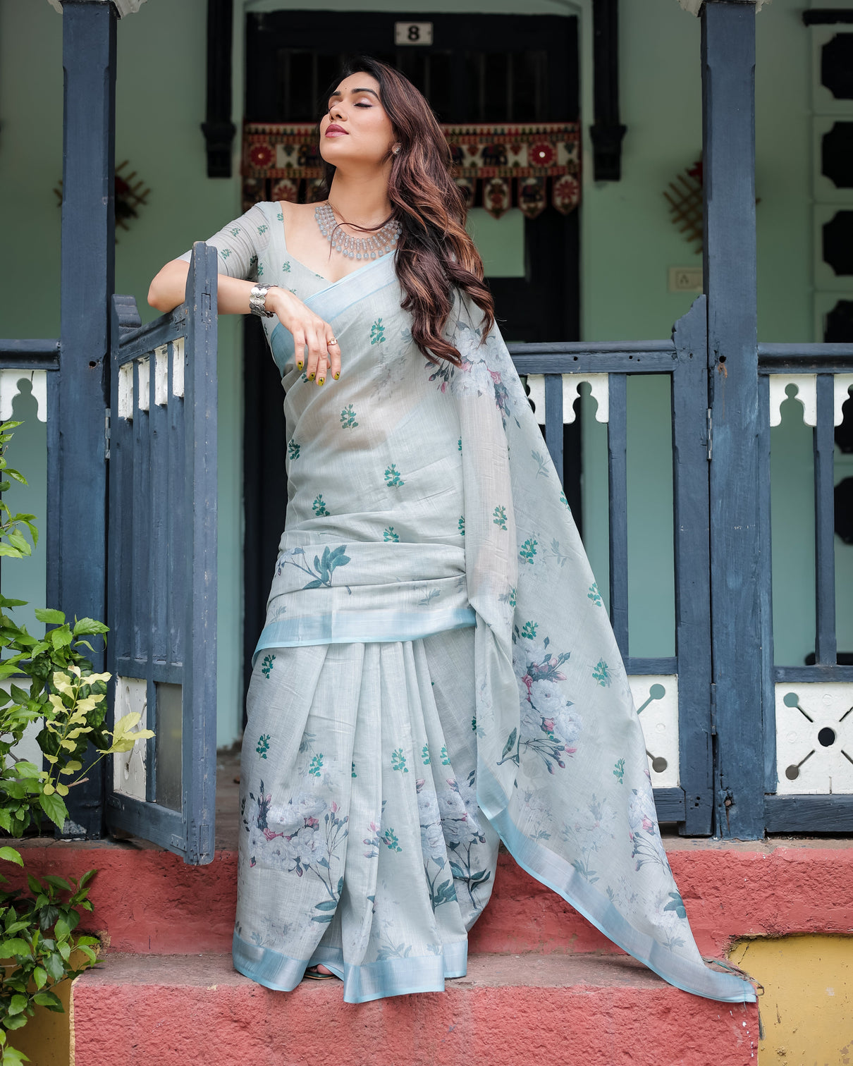 Pastel grey pure cotton linen saree with floral print blouse and tassel detailing