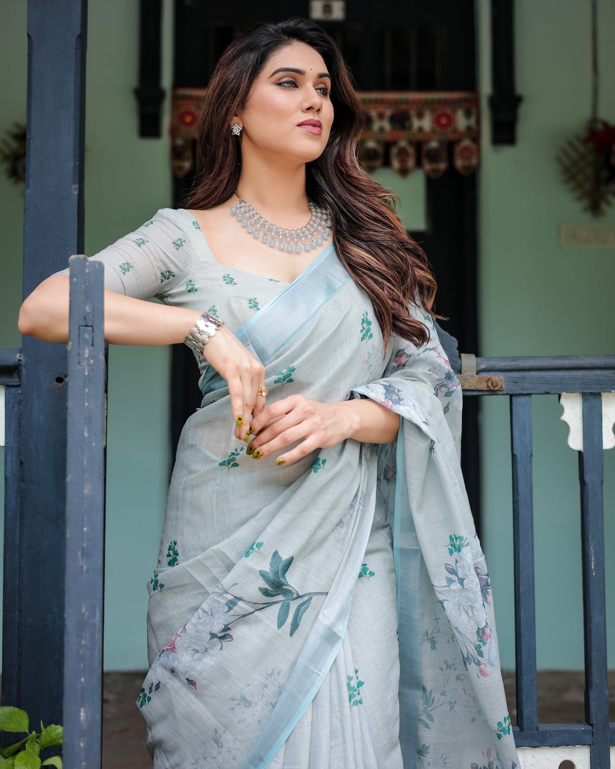 Pastel grey pure cotton linen saree with floral print blouse and tassel detailing