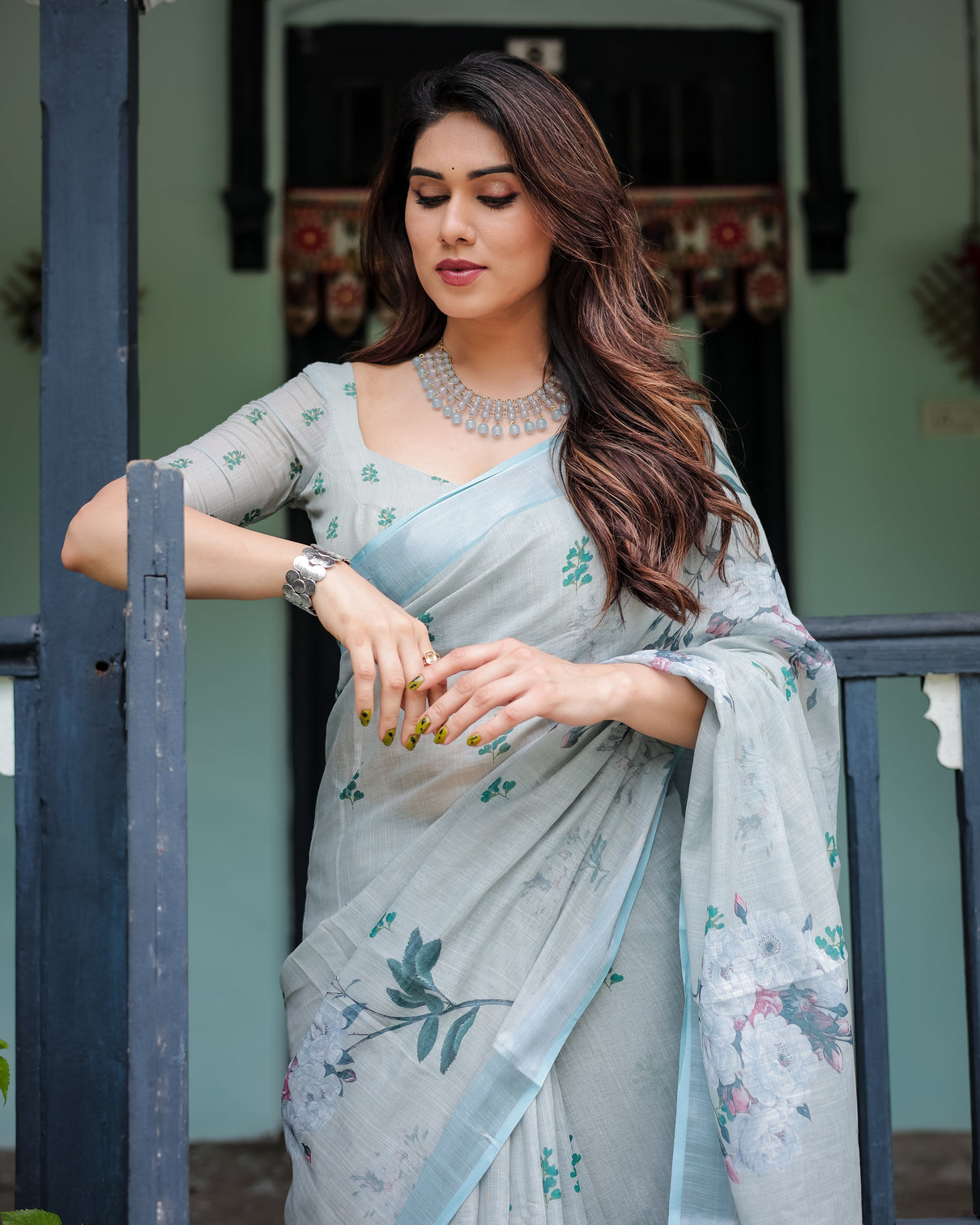 Pastel grey pure cotton linen saree with floral print blouse and tassel detailing