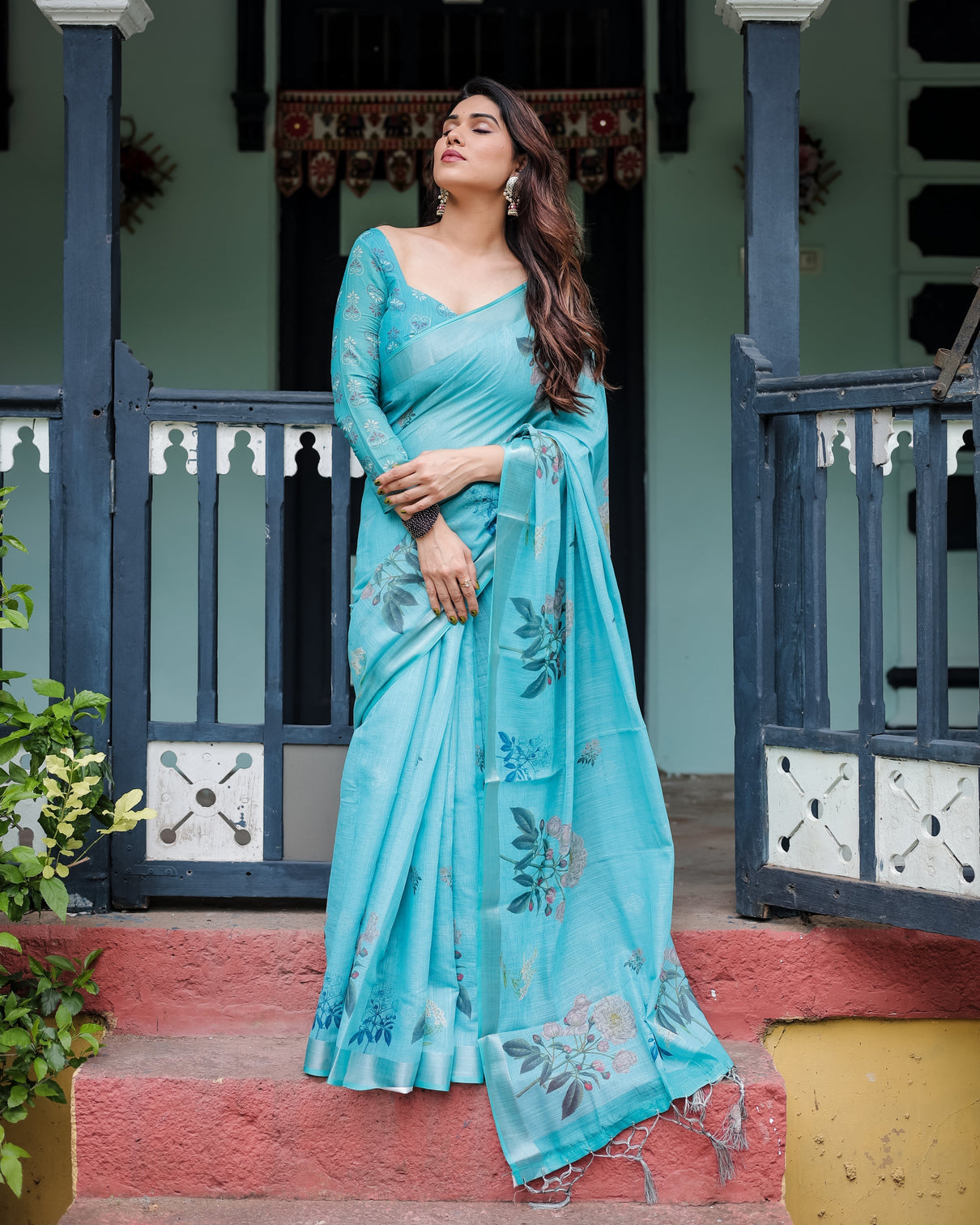 Aqua blue pure cotton linen saree with floral design blouse and tassel detailing