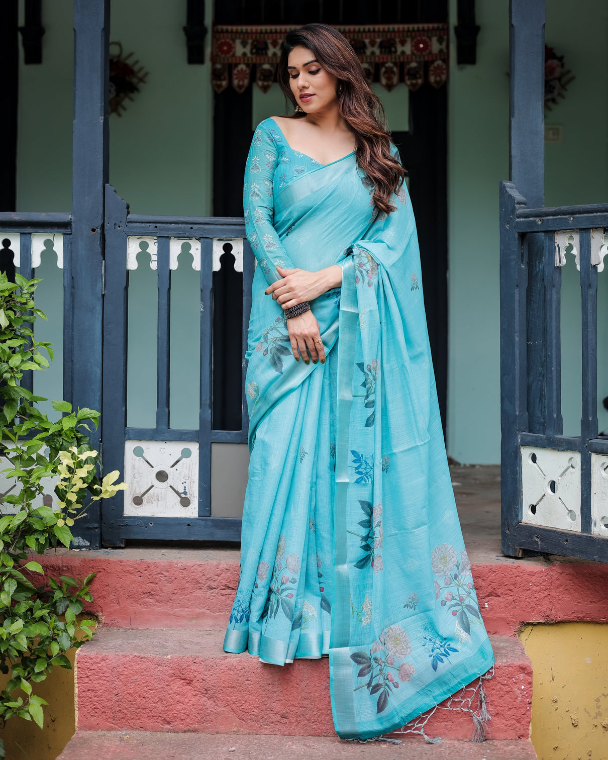 Aqua blue pure cotton linen saree with floral design blouse and tassel detailing