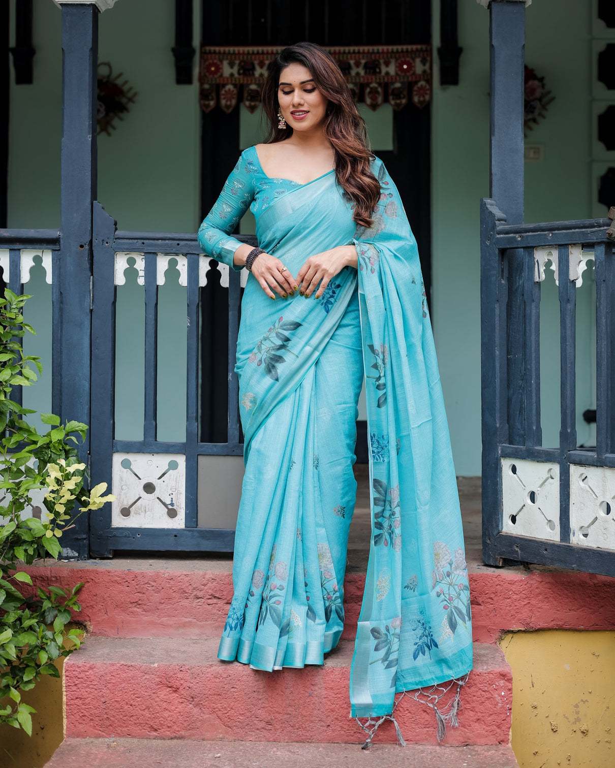 Aqua blue pure cotton linen saree with floral design blouse and tassel detailing