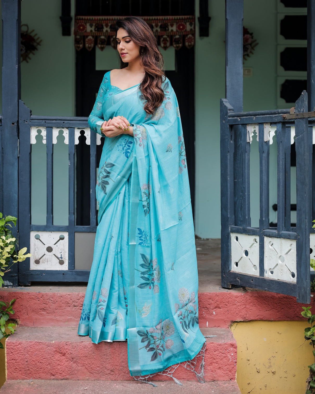Aqua blue pure cotton linen saree with floral design blouse and tassel detailing