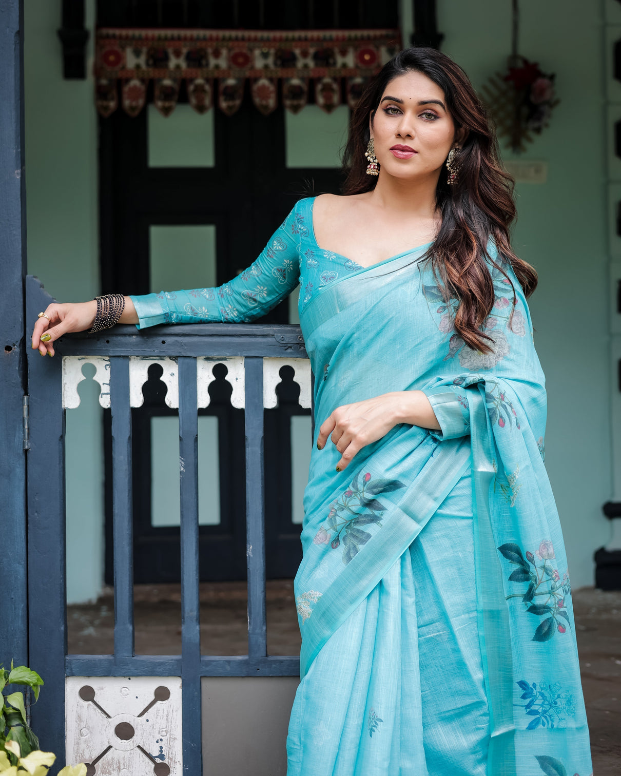 Aqua blue pure cotton linen saree with floral design blouse and tassel detailing