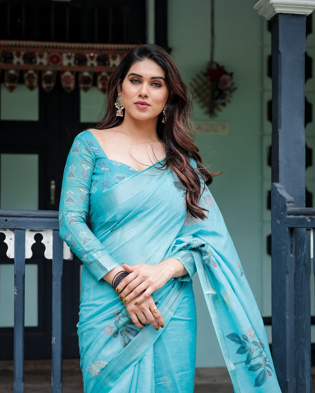 Aqua blue pure cotton linen saree with floral design blouse and tassel detailing
