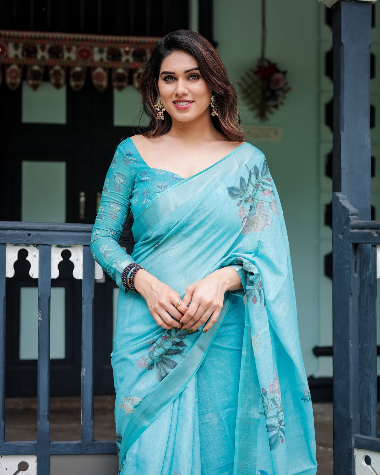 Aqua blue pure cotton linen saree with floral design blouse and tassel detailing