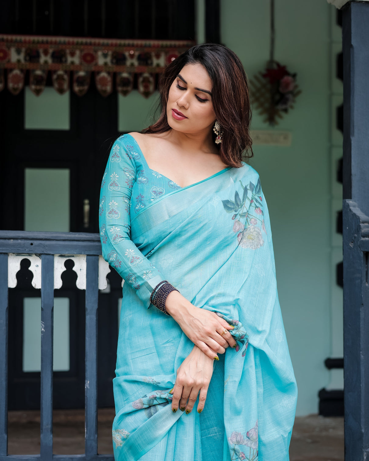 Aqua blue pure cotton linen saree with floral design blouse and tassel detailing