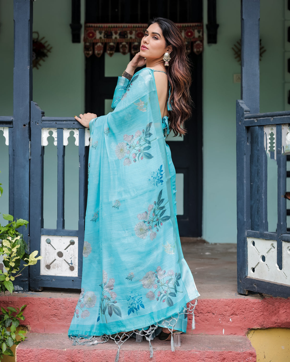 Aqua blue pure cotton linen saree with floral design blouse and tassel detailing