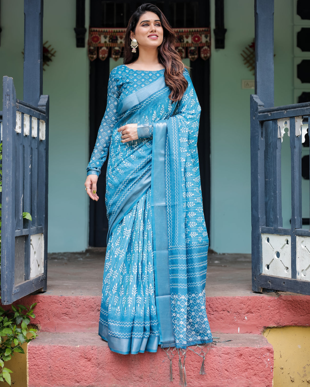 Turquoise pure cotton linen saree with white floral design blouse and tassel edges