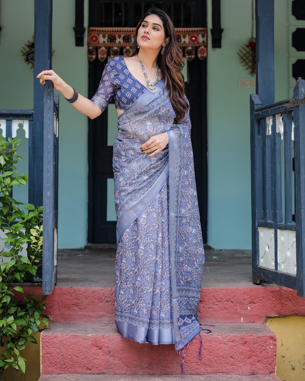 Steel blue pure cotton linen saree with floral and geometric block print blouse and tassel detailing