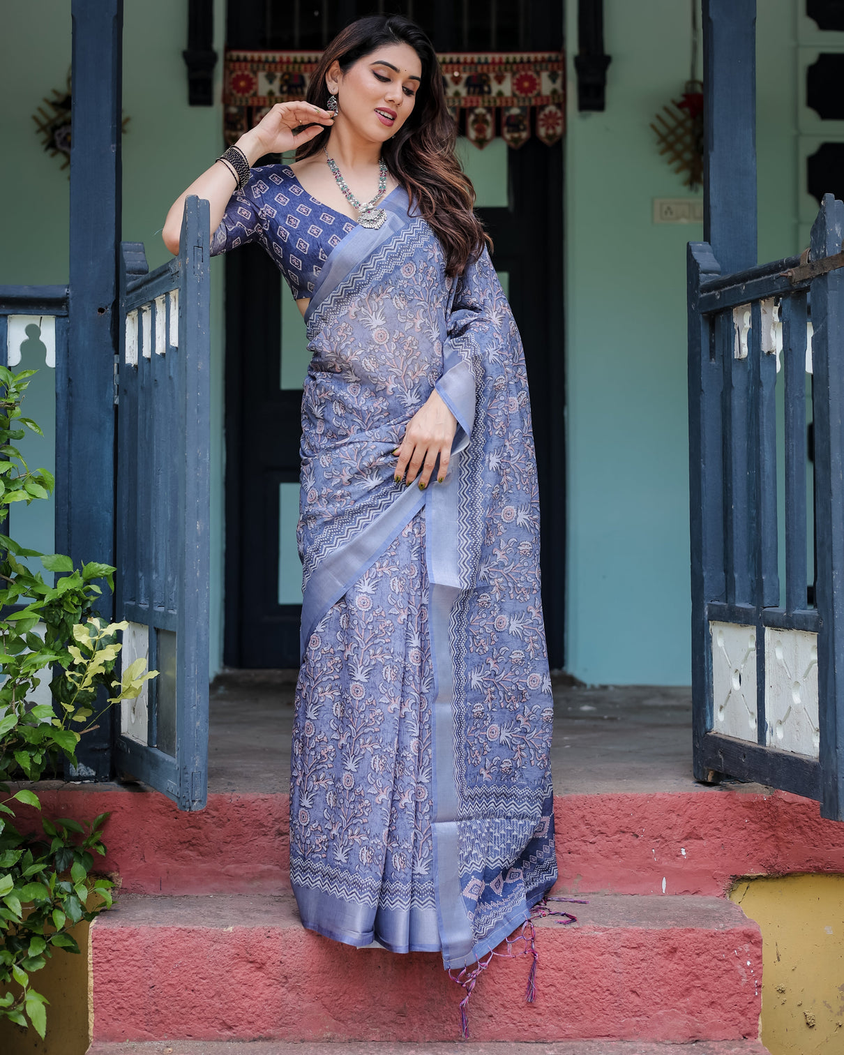 Steel blue pure cotton linen saree with floral and geometric block print blouse and tassel detailing