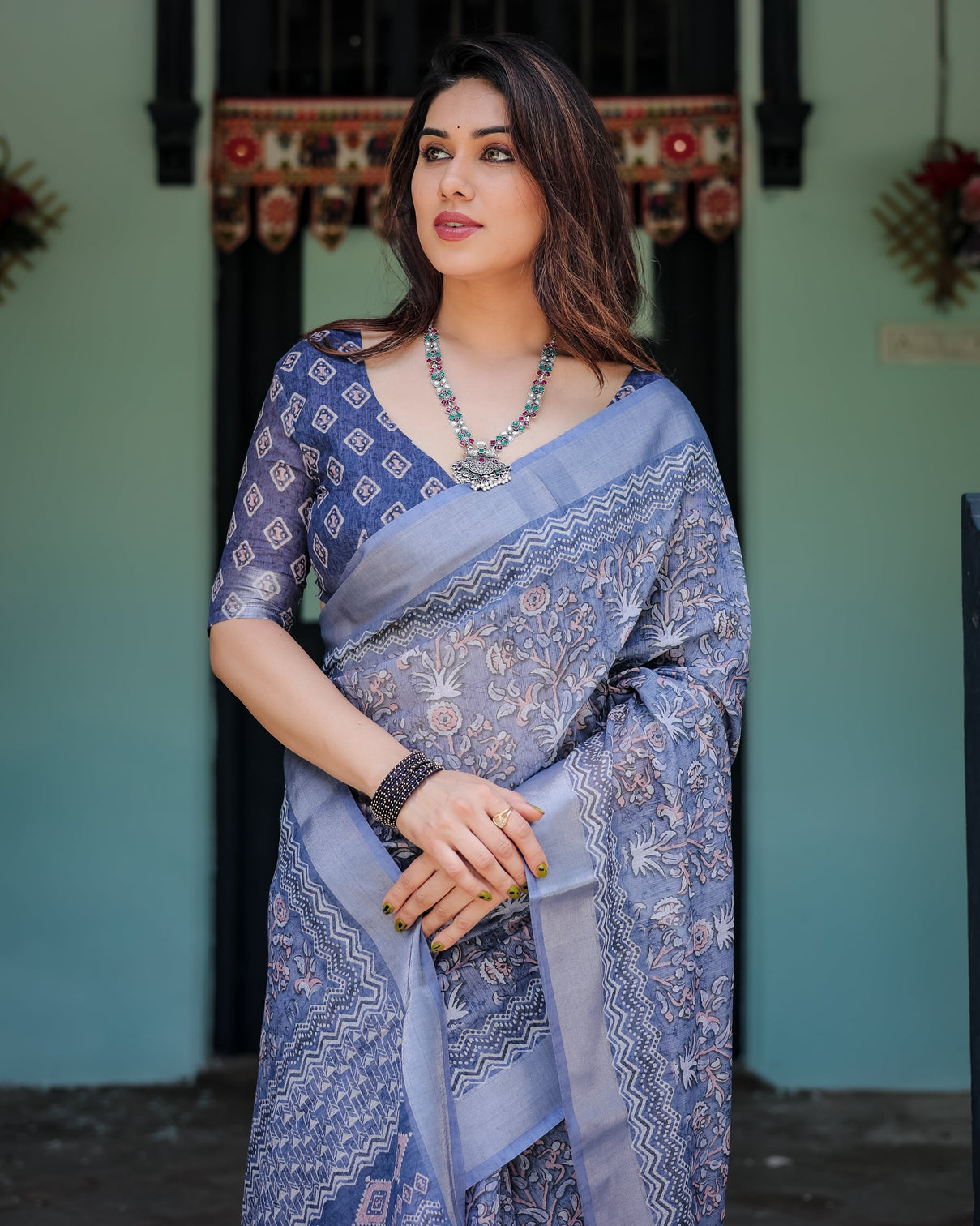 Steel blue pure cotton linen saree with floral and geometric block print blouse and tassel detailing