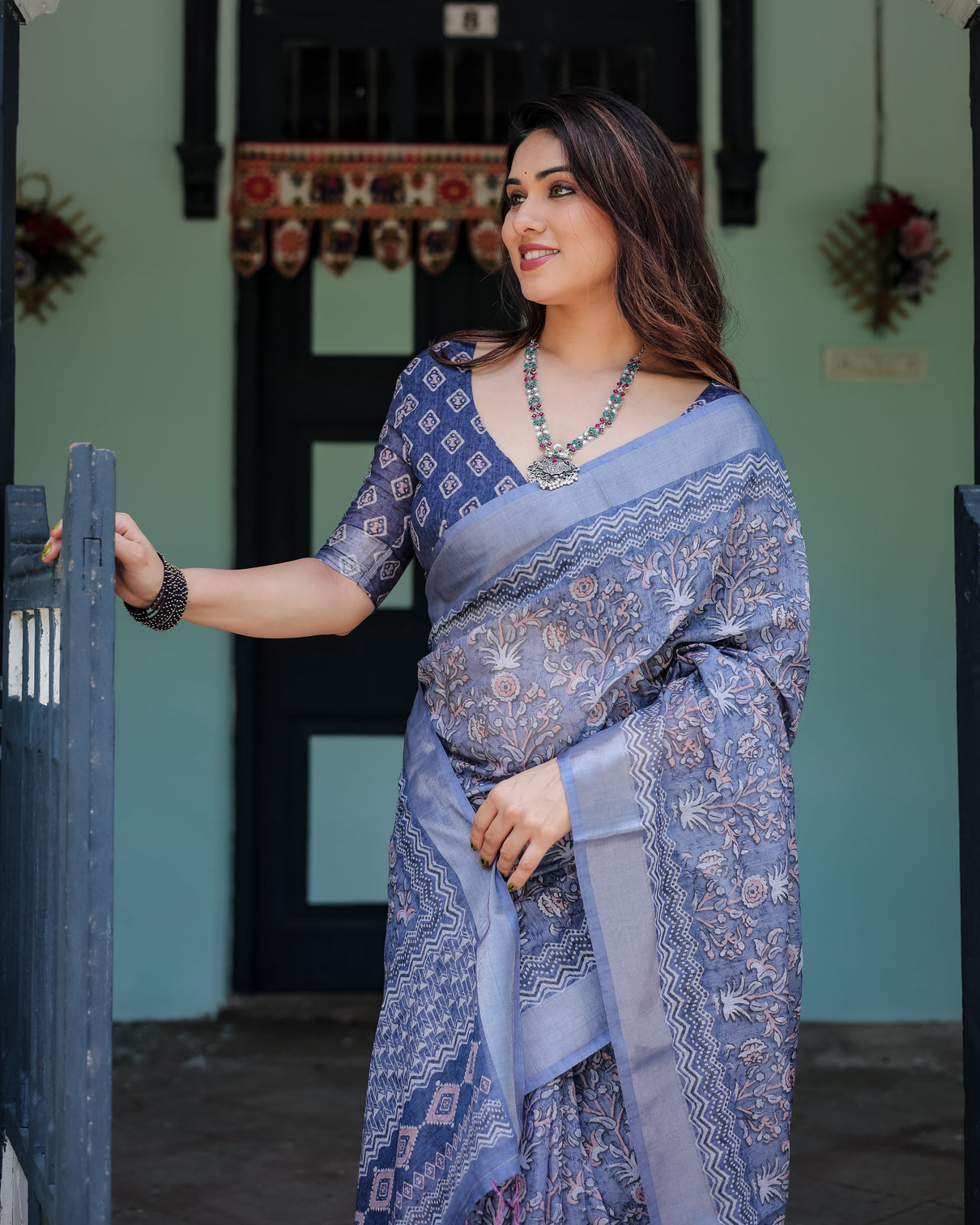 Steel blue pure cotton linen saree with floral and geometric block print blouse and tassel detailing