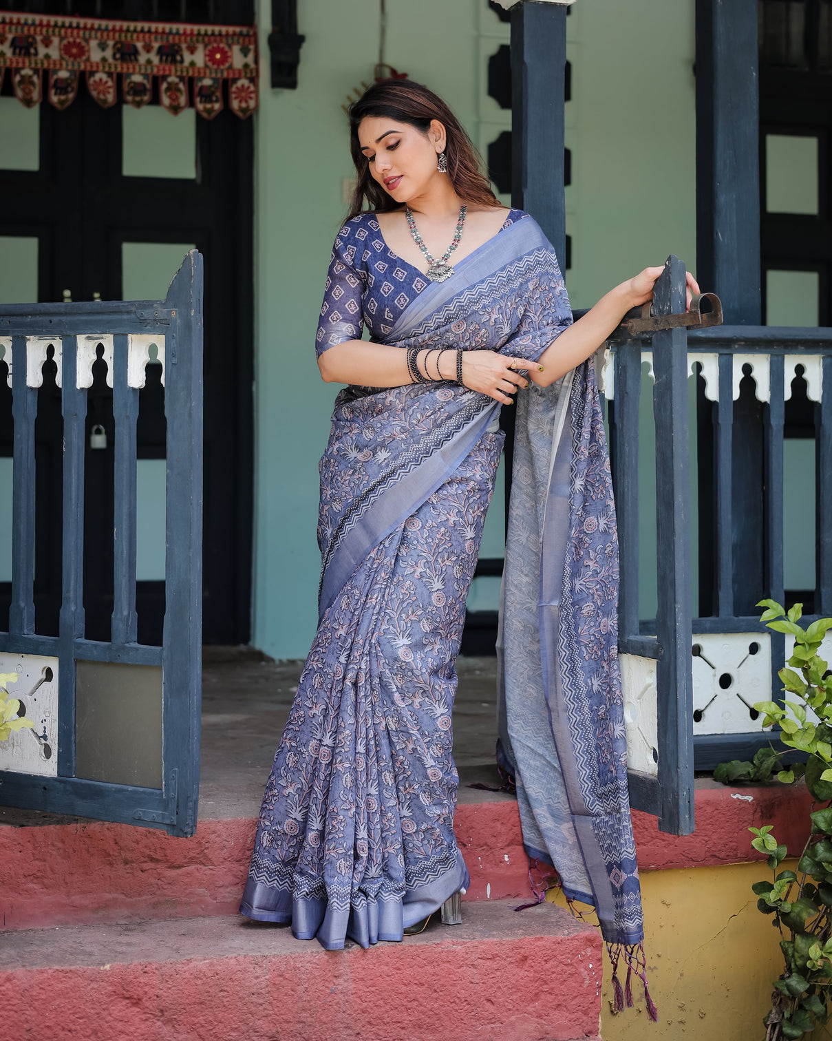 Steel blue pure cotton linen saree with floral and geometric block print blouse and tassel detailing