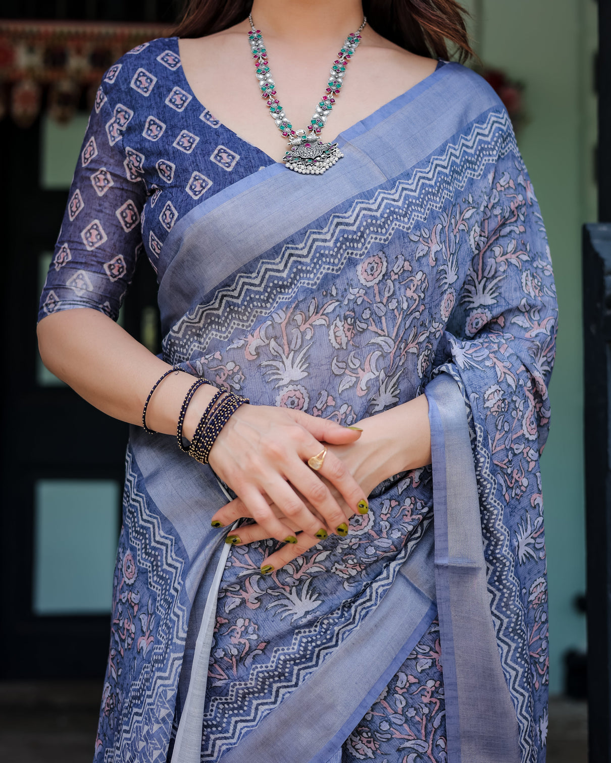 Steel blue pure cotton linen saree with floral and geometric block print blouse and tassel detailing