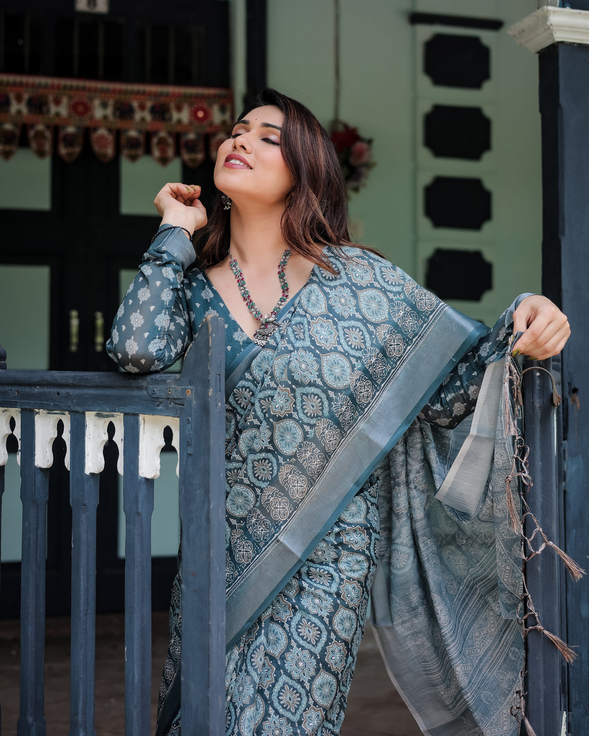 Teal blue pure cotton linen saree with geometric block print blouse and tassel detailing