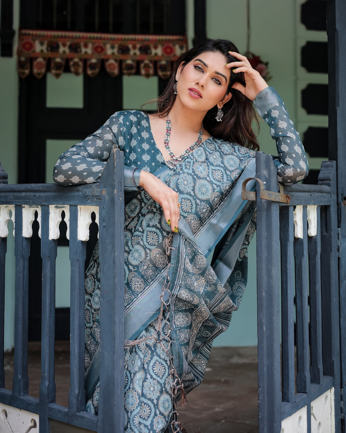 Teal blue pure cotton linen saree with geometric block print blouse and tassel detailing