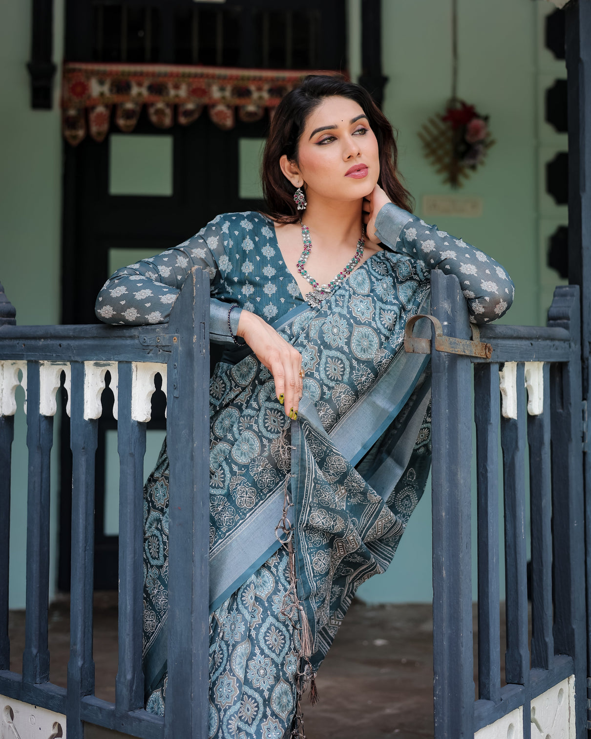 Teal blue pure cotton linen saree with geometric block print blouse and tassel detailing