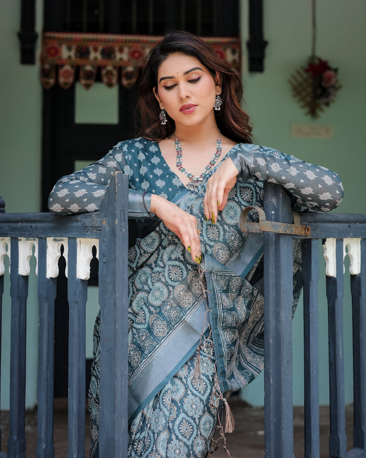 Teal blue pure cotton linen saree with geometric block print blouse and tassel detailing
