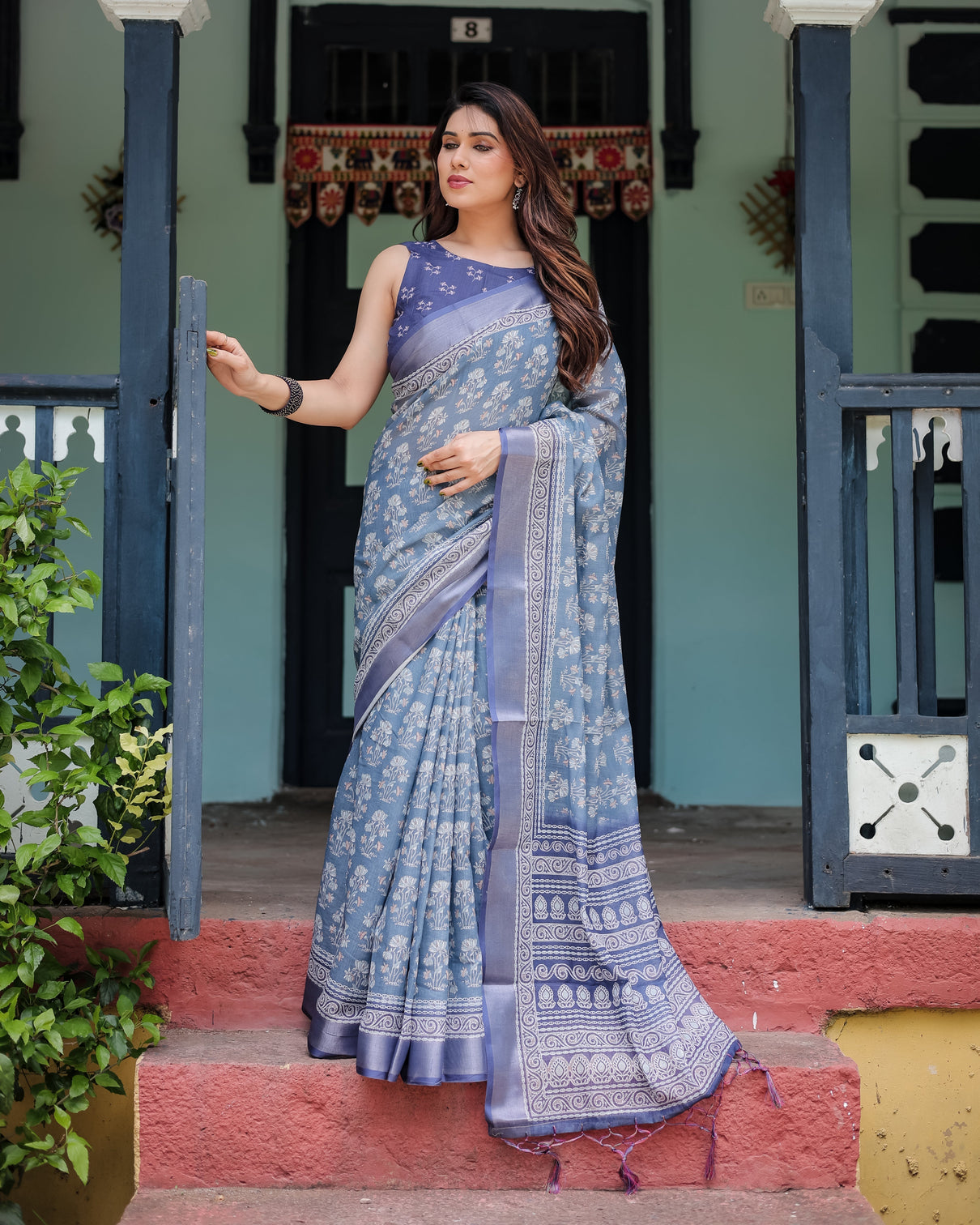 Elegant blue pure cotton linen saree with floral pattern blouse and tassels on edges