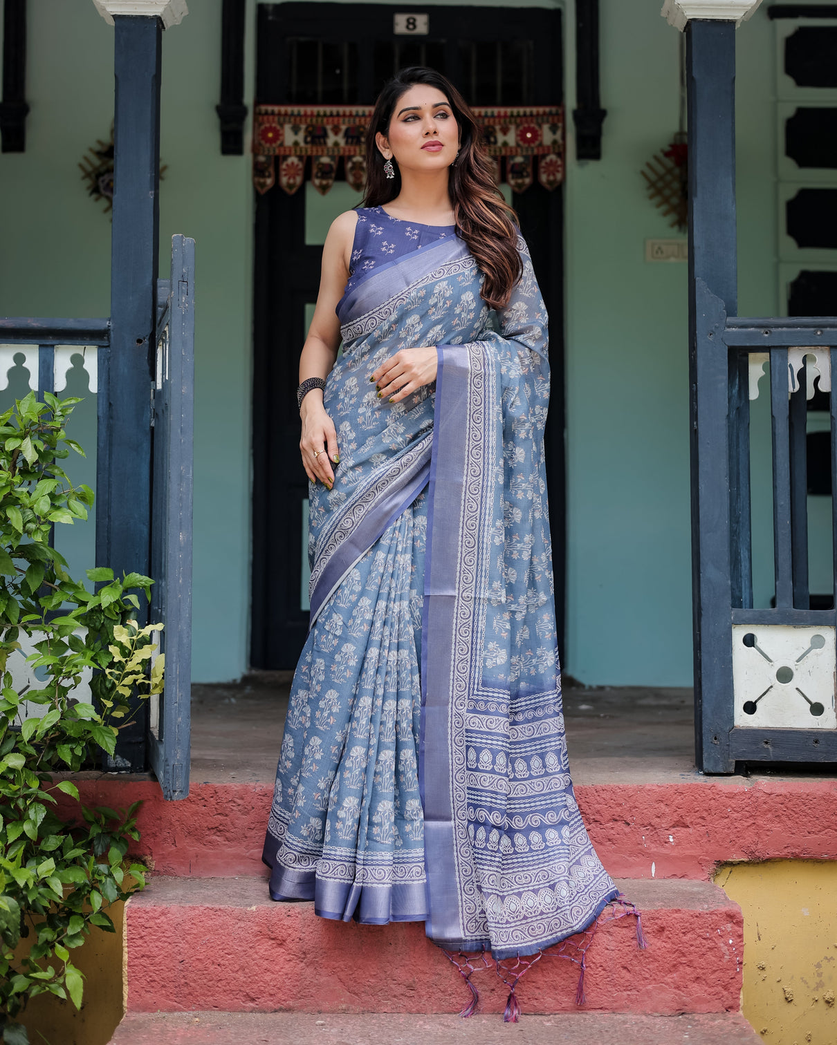 Elegant blue pure cotton linen saree with floral pattern blouse and tassels on edges