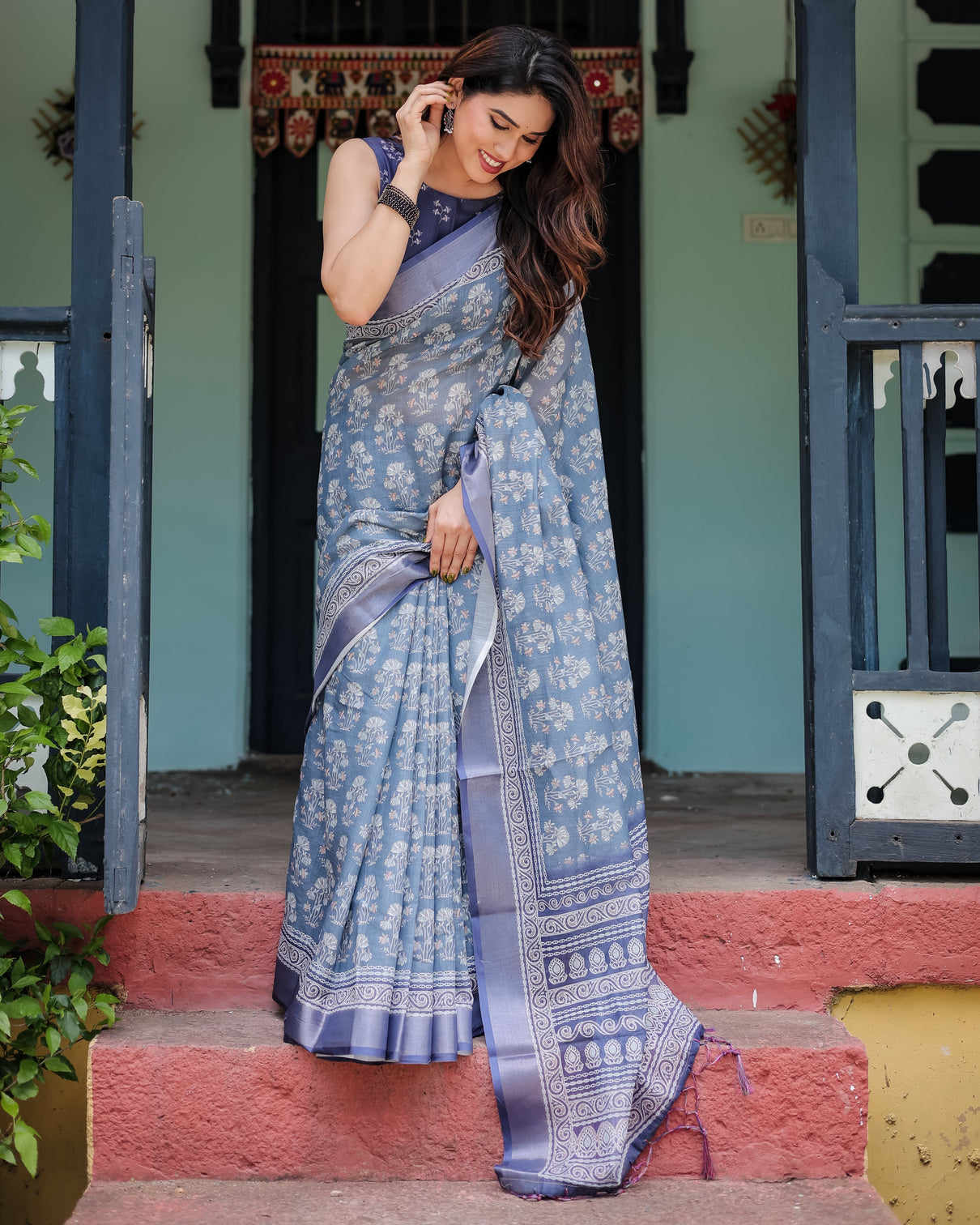 Elegant blue pure cotton linen saree with floral pattern blouse and tassels on edges