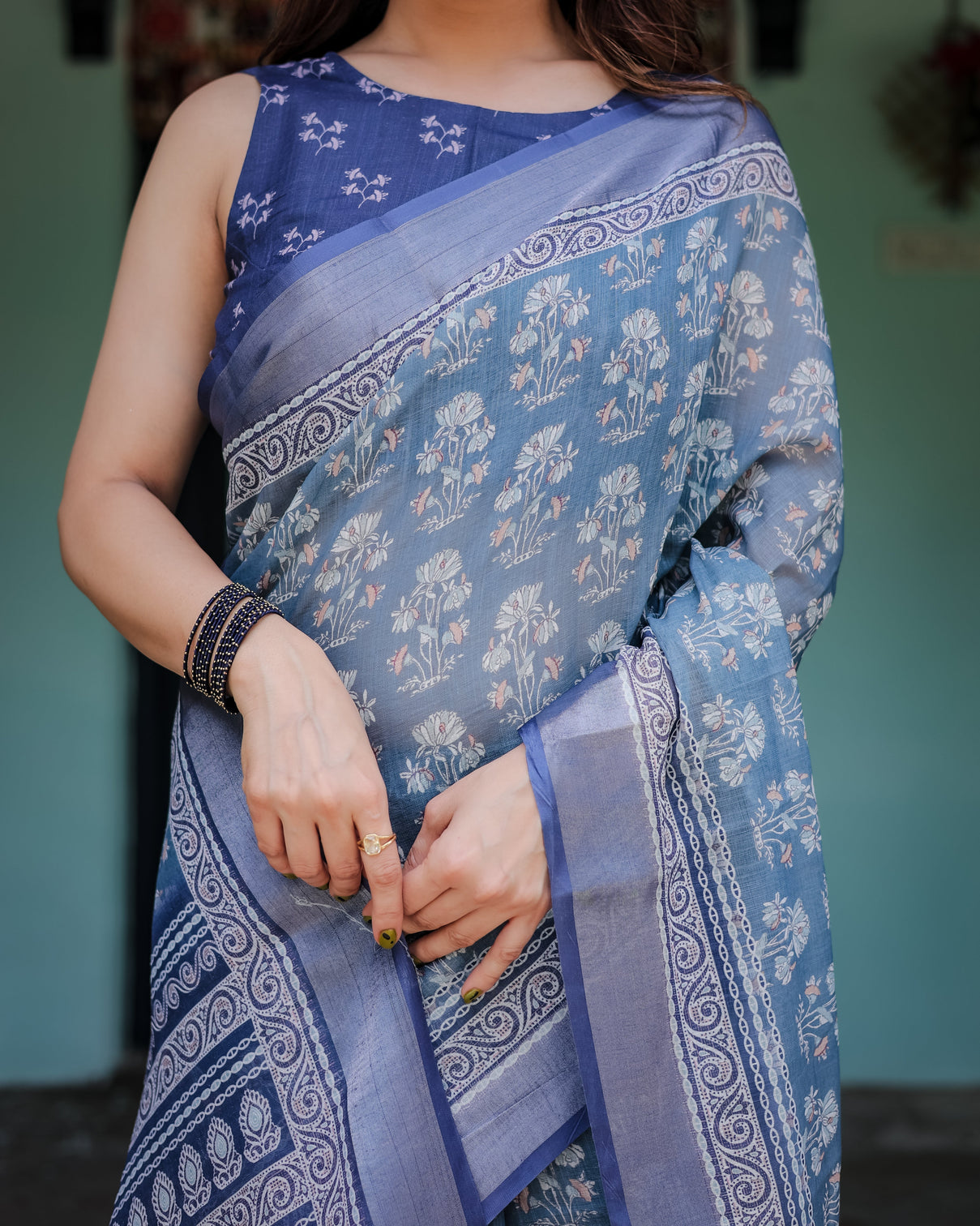 Elegant blue pure cotton linen saree with floral pattern blouse and tassels on edges