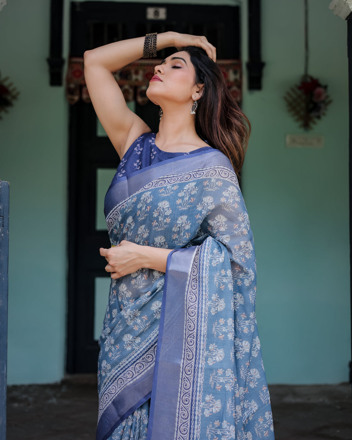 Elegant blue pure cotton linen saree with floral pattern blouse and tassels on edges