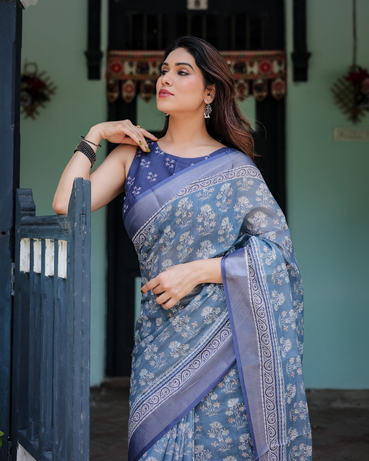Elegant blue pure cotton linen saree with floral pattern blouse and tassels on edges