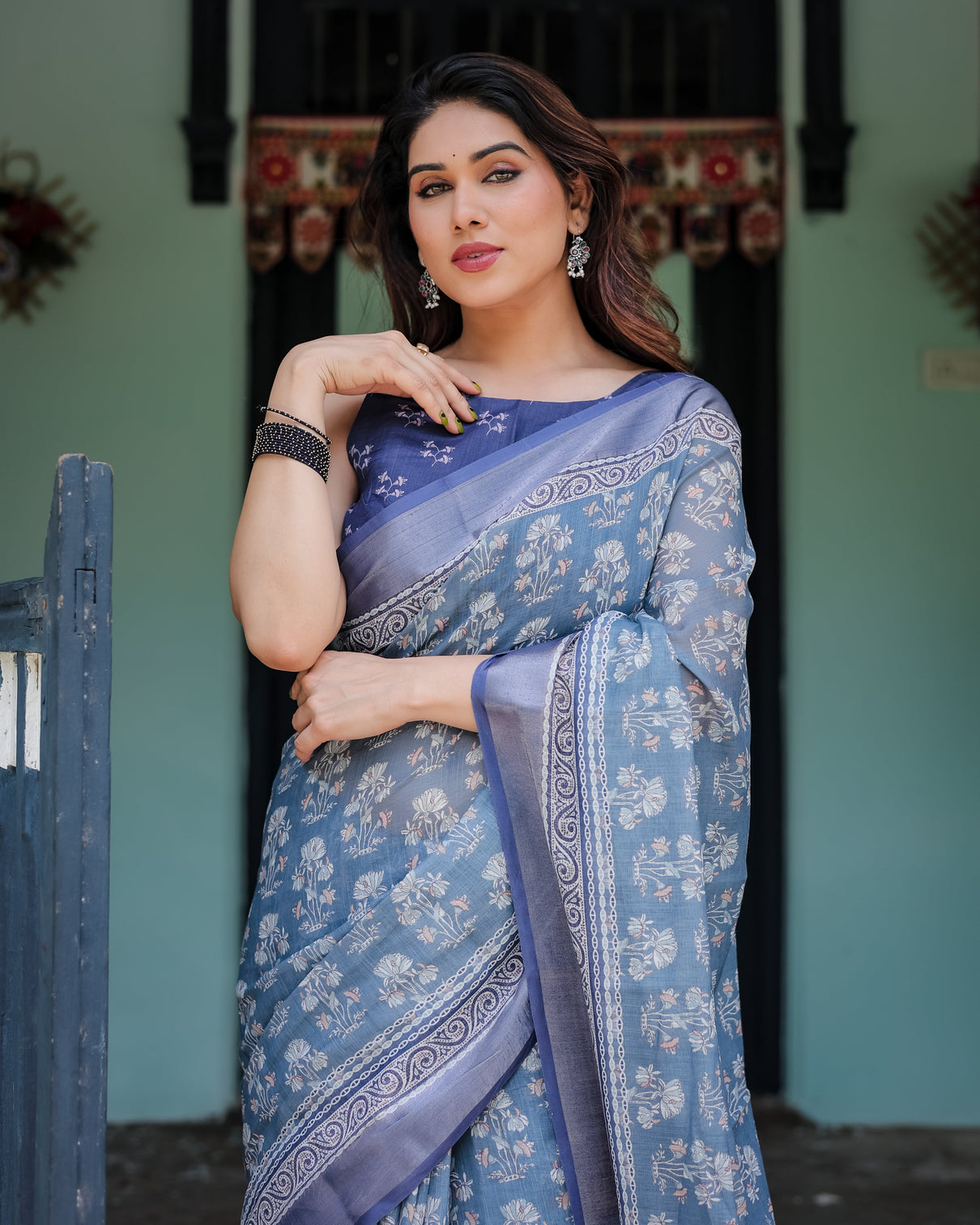 Elegant blue pure cotton linen saree with floral pattern blouse and tassels on edges