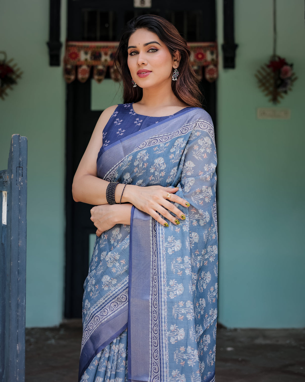 Elegant blue pure cotton linen saree with floral pattern blouse and tassels on edges