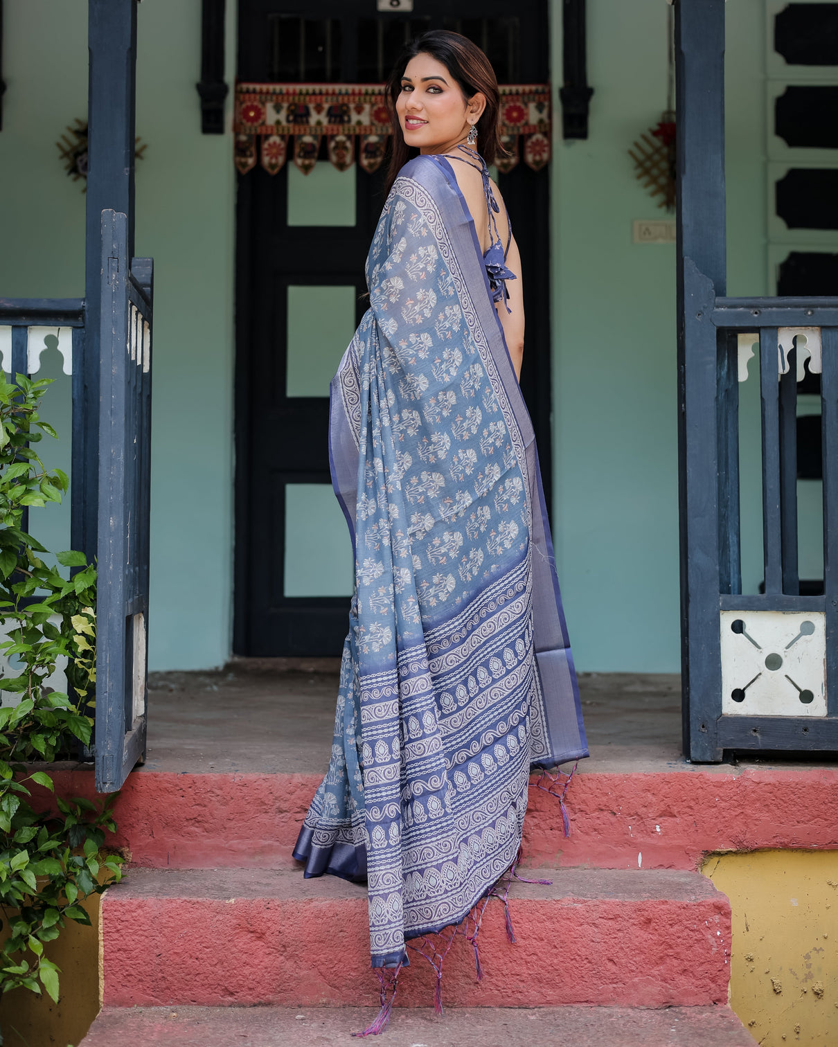 Elegant blue pure cotton linen saree with floral pattern blouse and tassels on edges