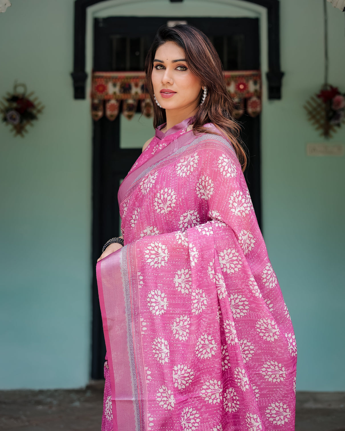 Magenta pure cotton linen saree with white floral block print blouse and tassel detailing