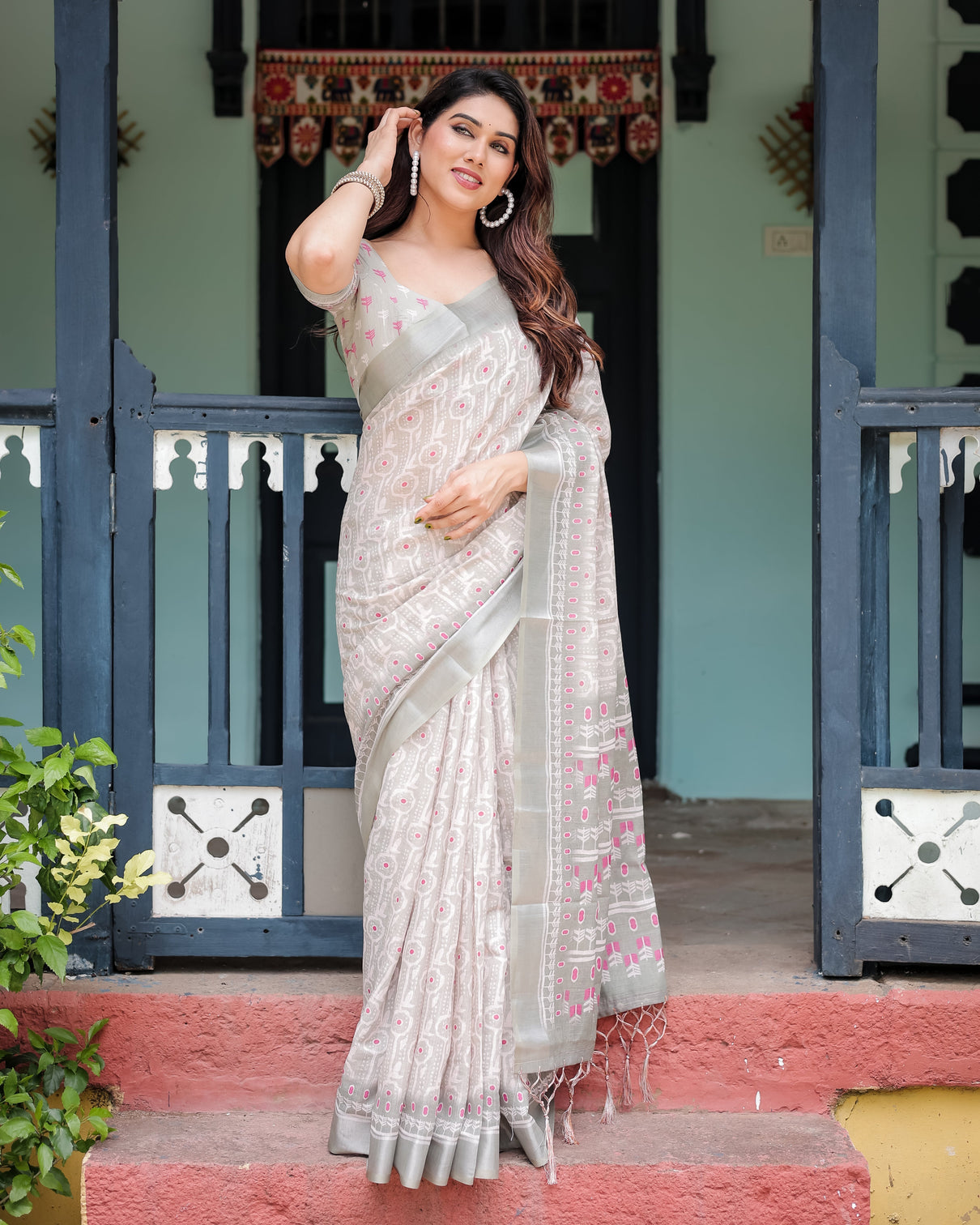Soft grey pure cotton linen saree with pink and white ikat design blouse and tassel detailing