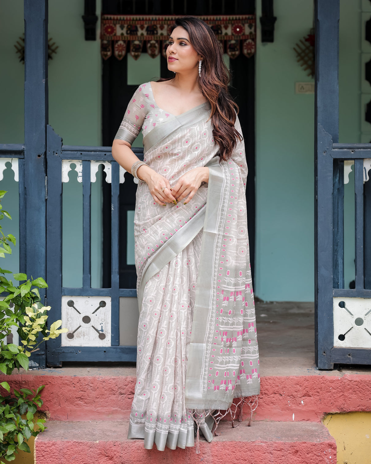 Soft grey pure cotton linen saree with pink and white ikat design blouse and tassel detailing