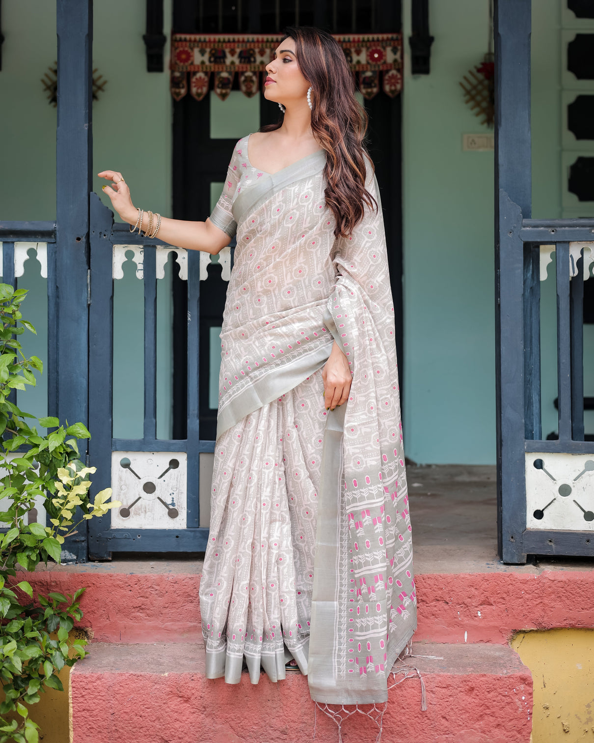 Soft grey pure cotton linen saree with pink and white ikat design blouse and tassel detailing